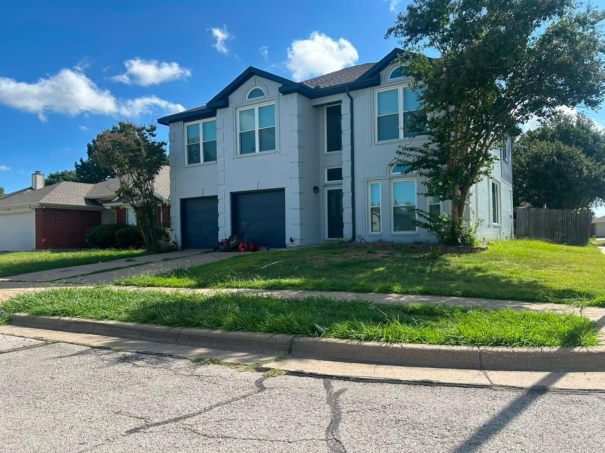 Two-story home lawn mowing & perimeter trimming — before
